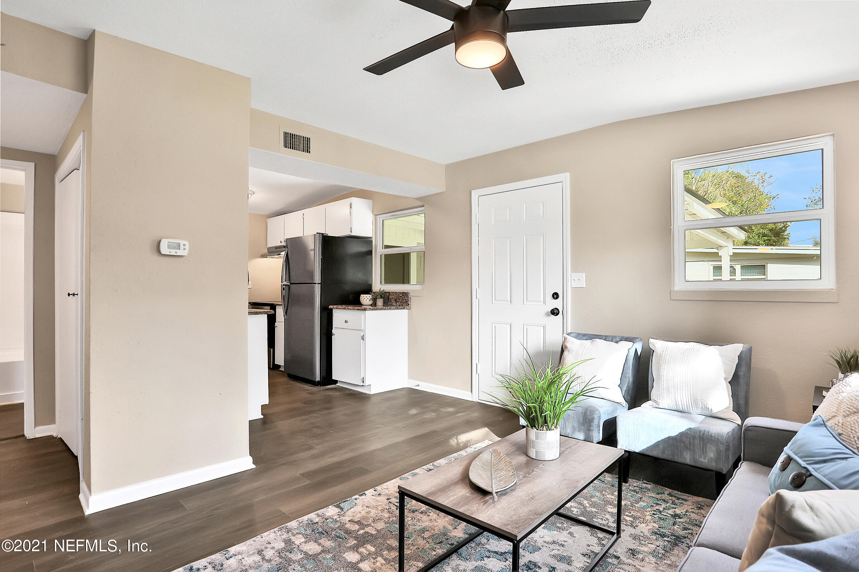 6823 Morgana Road North Jacksonville, FL 32211 - Photo 5 of 23 a living room with furniture and a view of kitchen