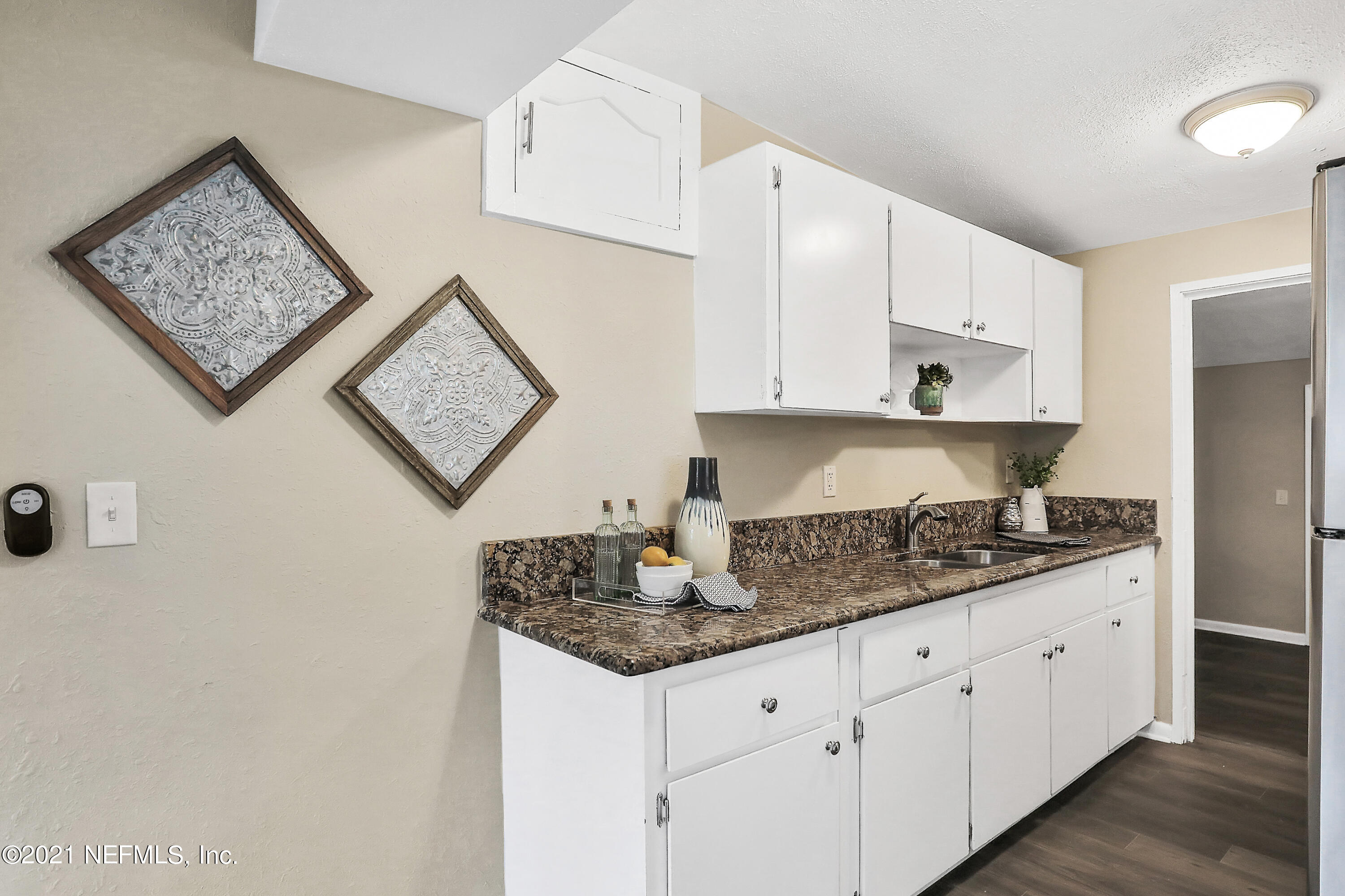 6823 Morgana Road North Jacksonville, FL 32211 - Photo 9 of 23 a kitchen with stainless steel appliances granite countertop a sink stove and cabinets