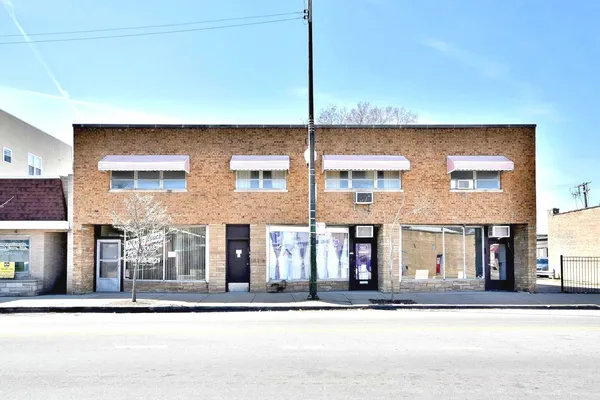 a front view of a building with street view