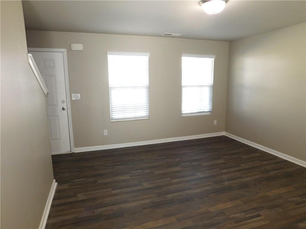 343 Indian Lake Trail Villa Rica, GA 30180 - Photo 3 of 29 an empty room with wooden floor and windows
