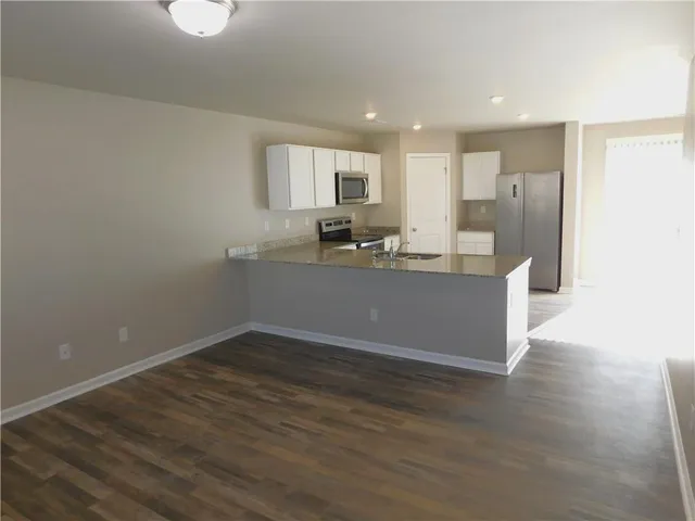 a view of staircase with white walls