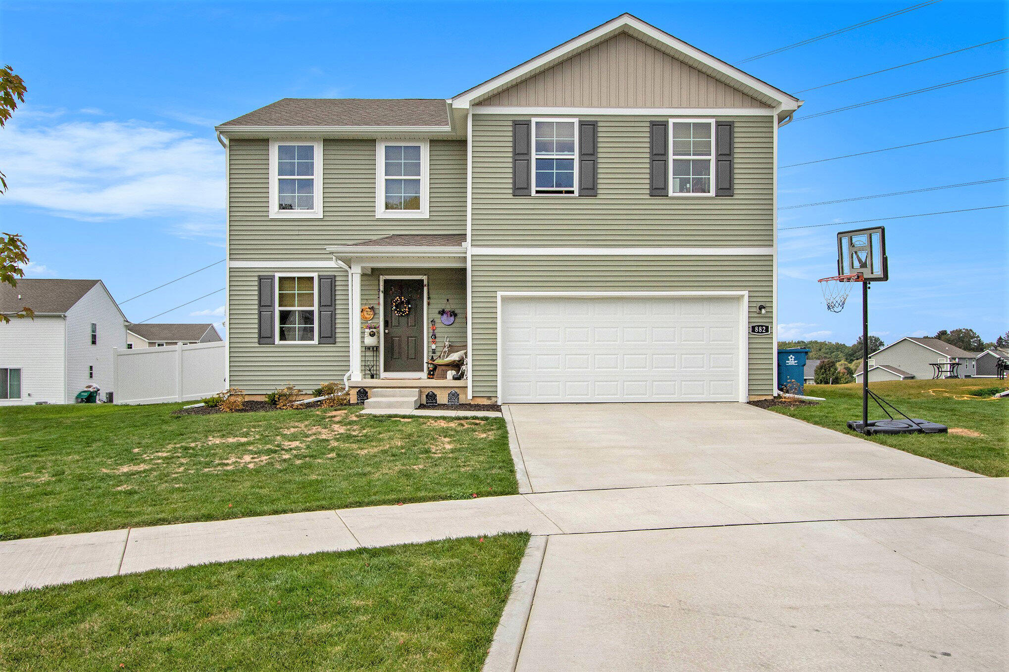 a front view of a house with a yard