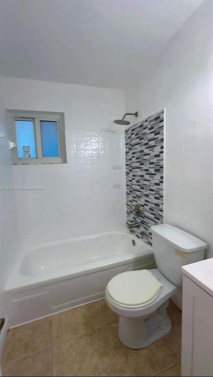 984 West 40th Street, Unit 2 Hialeah, FL 33012 - Photo 11 of 14 a bathroom with a toilet a sink and shower