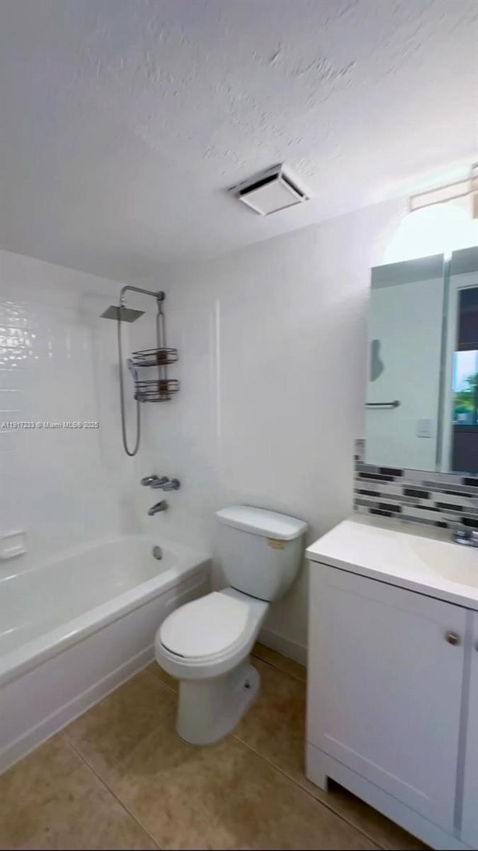 984 West 40th Street, Unit 2 Hialeah, FL 33012 - Photo 12 of 14 a bathroom with a sink a toilet and a bathtub