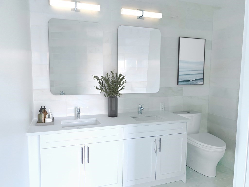 301 Border Street, Unit 612 Boston, MA 02128 - Photo 21 of 32 a bathroom with a sink and a mirror