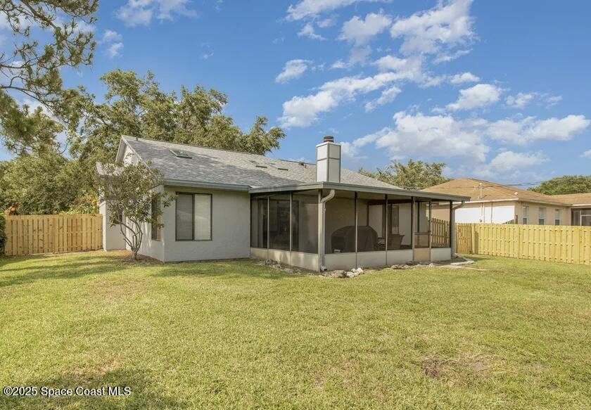 1626 Lara Street Northeast Palm Bay, FL 32907 - Photo 11 of 11 a view of a house with a yard
