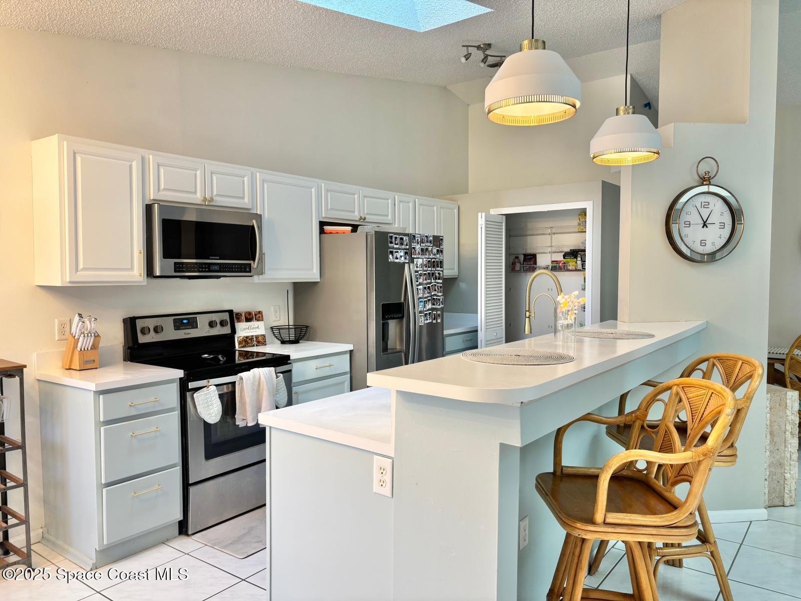1626 Lara Street Northeast Palm Bay, FL 32907 - Photo 2 of 11 a view of kitchen with cabinets and wooden floor