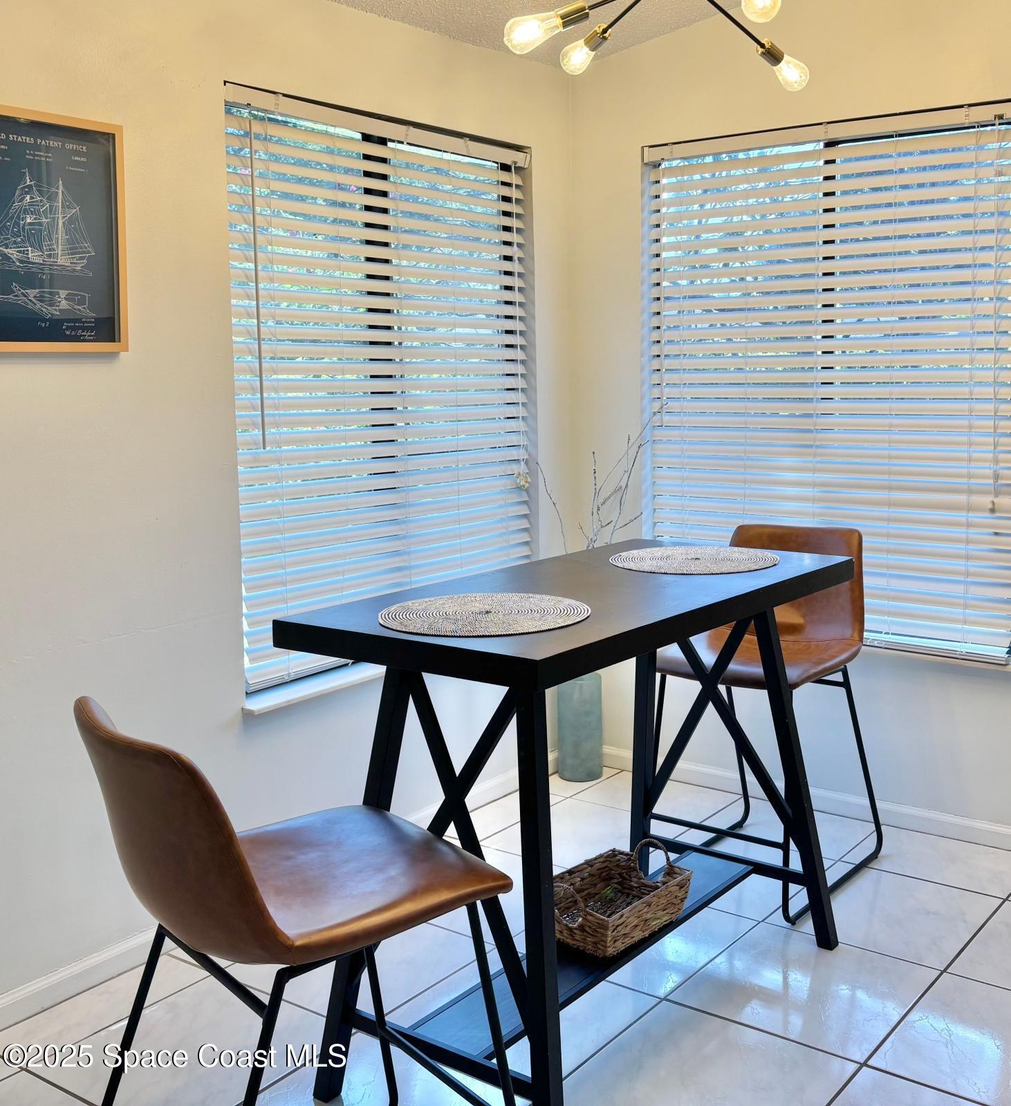 1626 Lara Street Northeast Palm Bay, FL 32907 - Photo 3 of 11 a view of a workspace room with furniture and a window