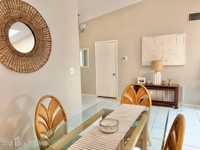 a view of a bedroom with furniture and a window