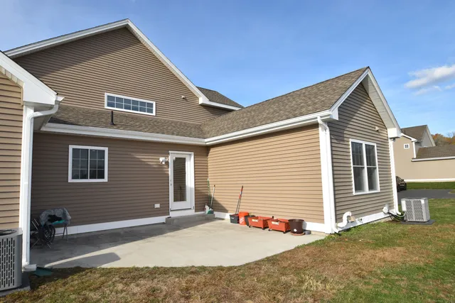 a backyard of a house with seating space