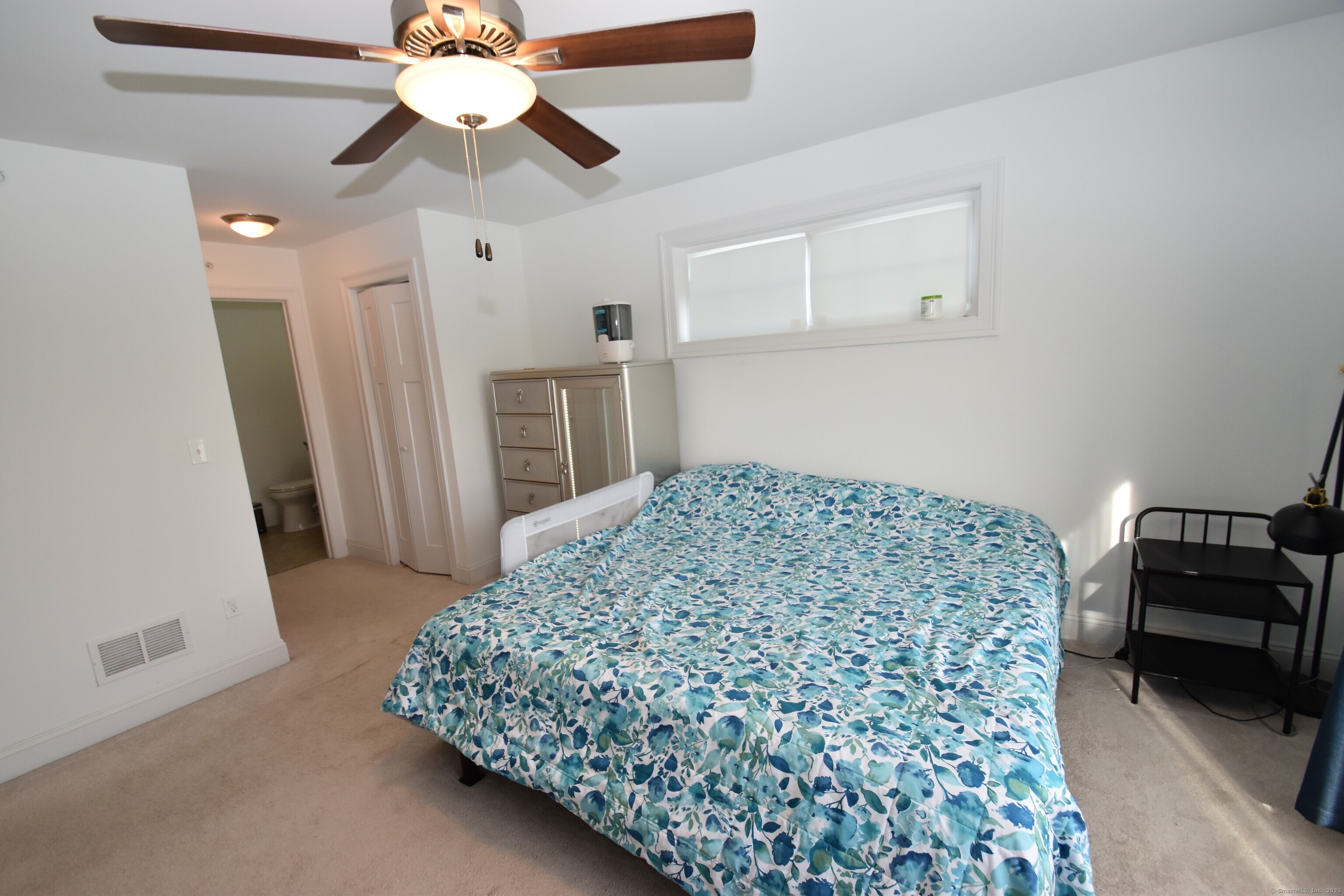 501 Old Village Circle Windsor, CT 06095 - Photo 8 of 16 a bedroom with a bed and a couch