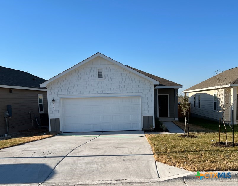 a front view of a house with a garage
