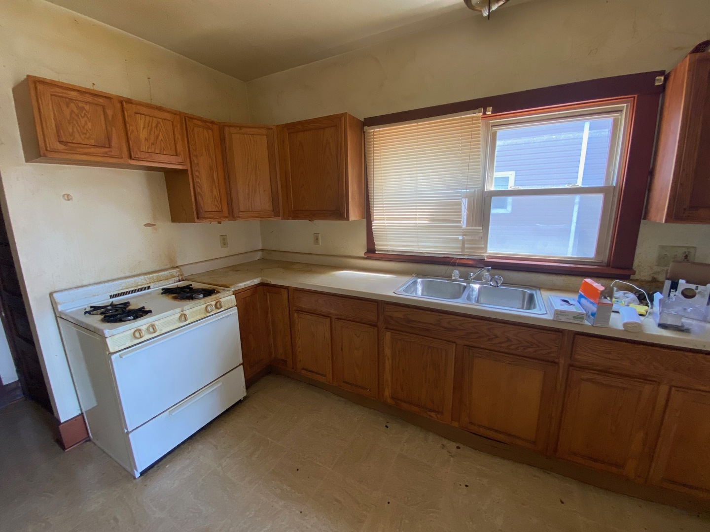 330 West Everett Street Dixon, IL 61021 - Photo 6 of 34 a kitchen with sink cabinets and window