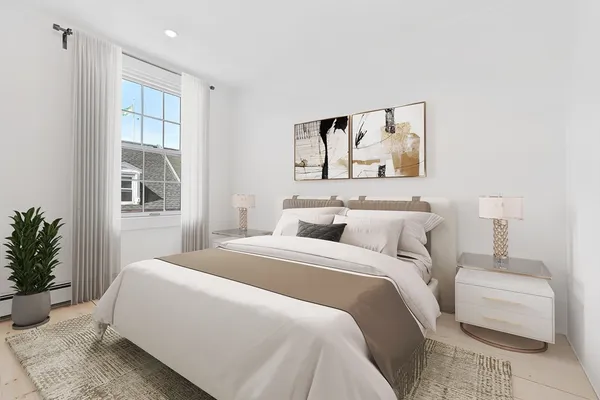 a spacious bedroom with a bed and a couch
