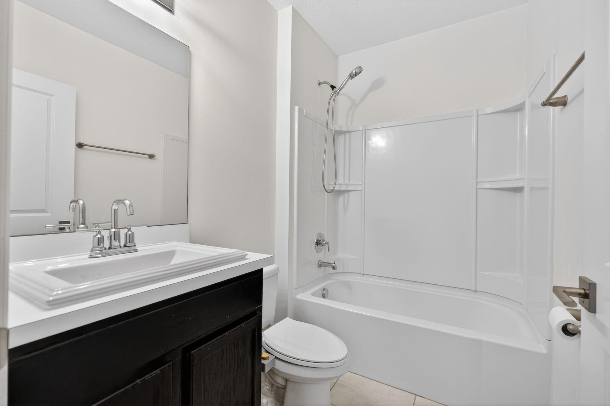 6814 Mitchell Street Jupiter, FL 33458 - Photo 11 of 49 a bathroom with a sink a toilet and shower