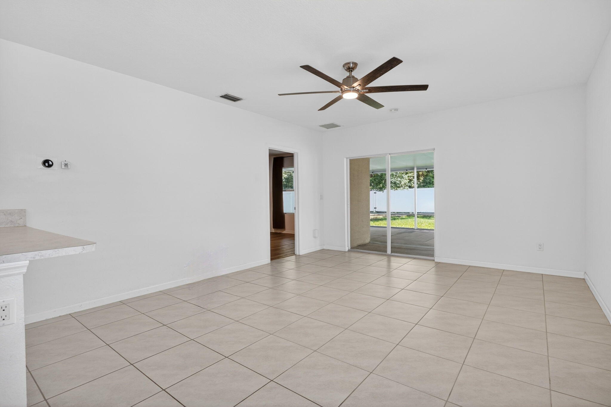 6814 Mitchell Street Jupiter, FL 33458 - Photo 22 of 49 a view of an empty room and window