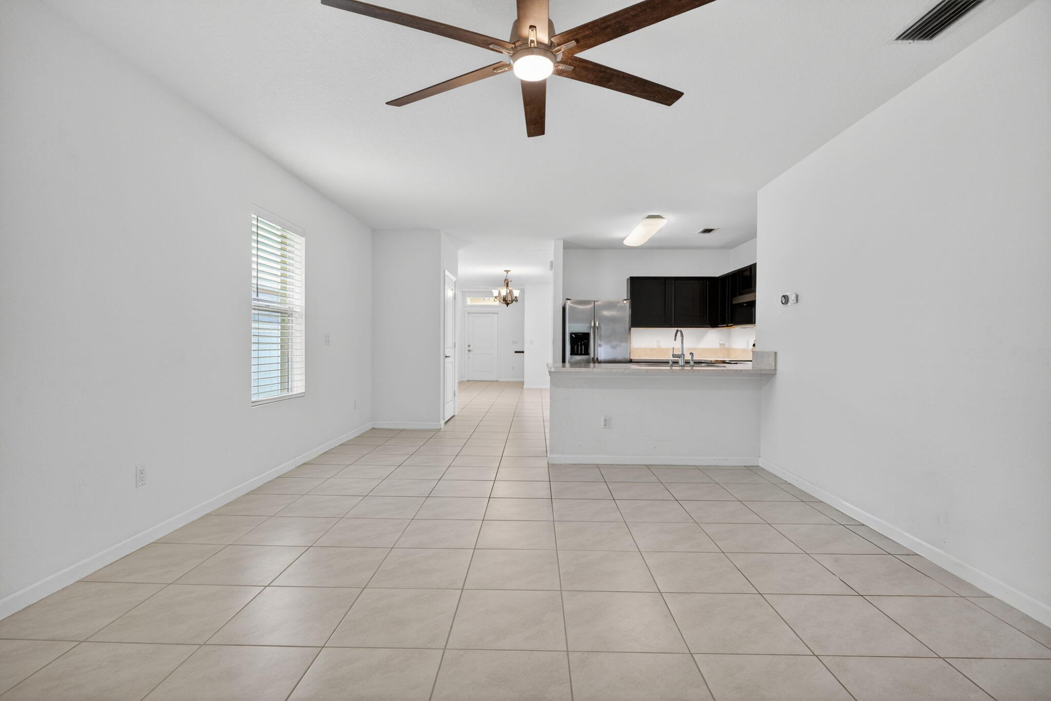 6814 Mitchell Street Jupiter, FL 33458 - Photo 24 of 49 a view of a kitchen with a sink and a dishwasher cabinets