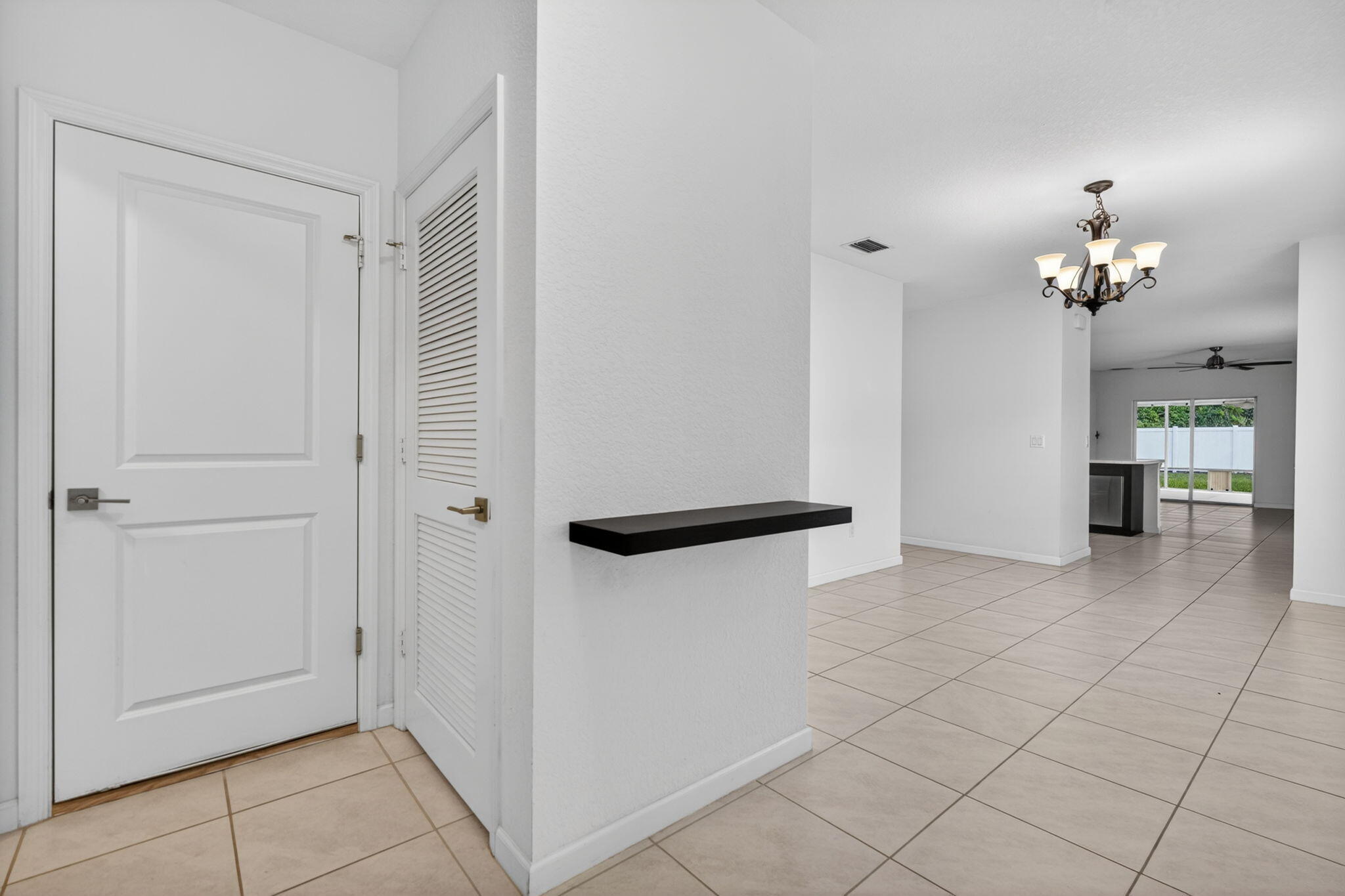 6814 Mitchell Street Jupiter, FL 33458 - Photo 3 of 49 a view of livingroom with kitchen