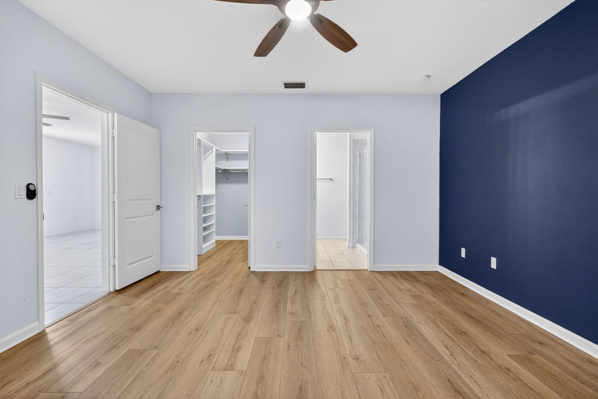 6814 Mitchell Street Jupiter, FL 33458 - Photo 31 of 49 a view of empty room with wooden floor