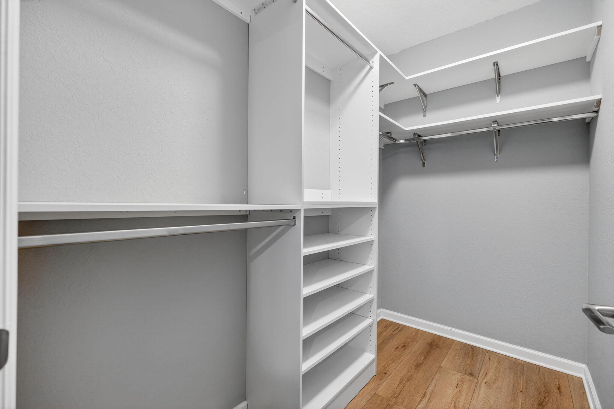 6814 Mitchell Street Jupiter, FL 33458 - Photo 33 of 49 a view of walk in closet with empty racks