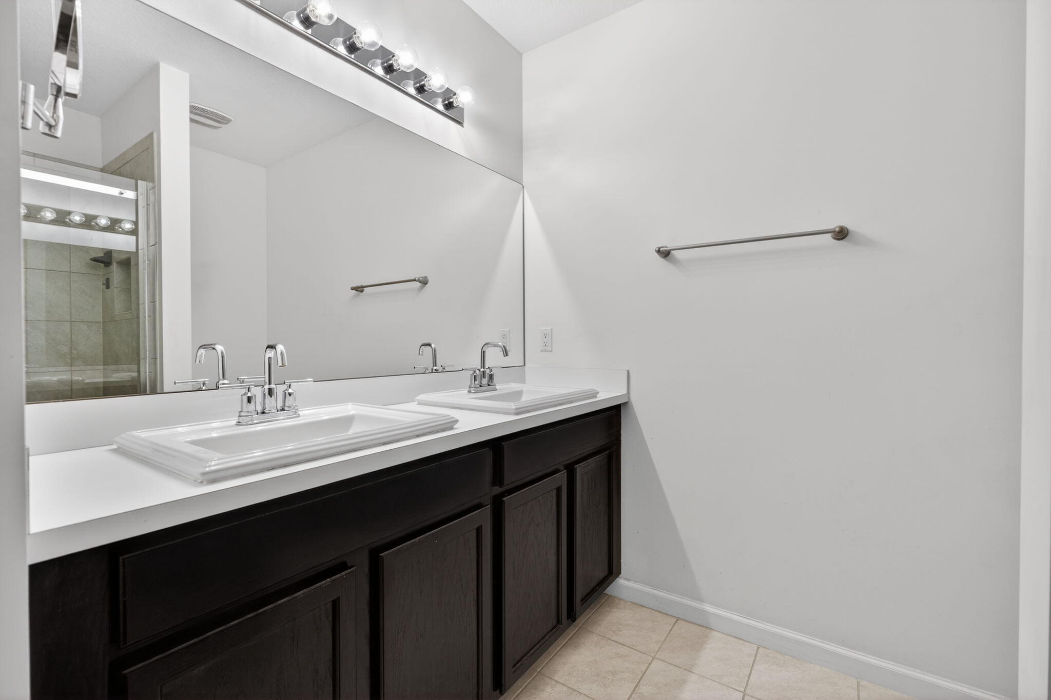 6814 Mitchell Street Jupiter, FL 33458 - Photo 35 of 49 a bathroom with a sink and a mirror