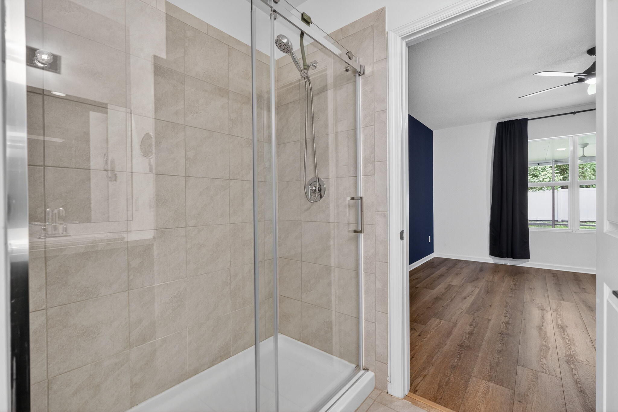 6814 Mitchell Street Jupiter, FL 33458 - Photo 36 of 49 a bathroom with a shower and a tub