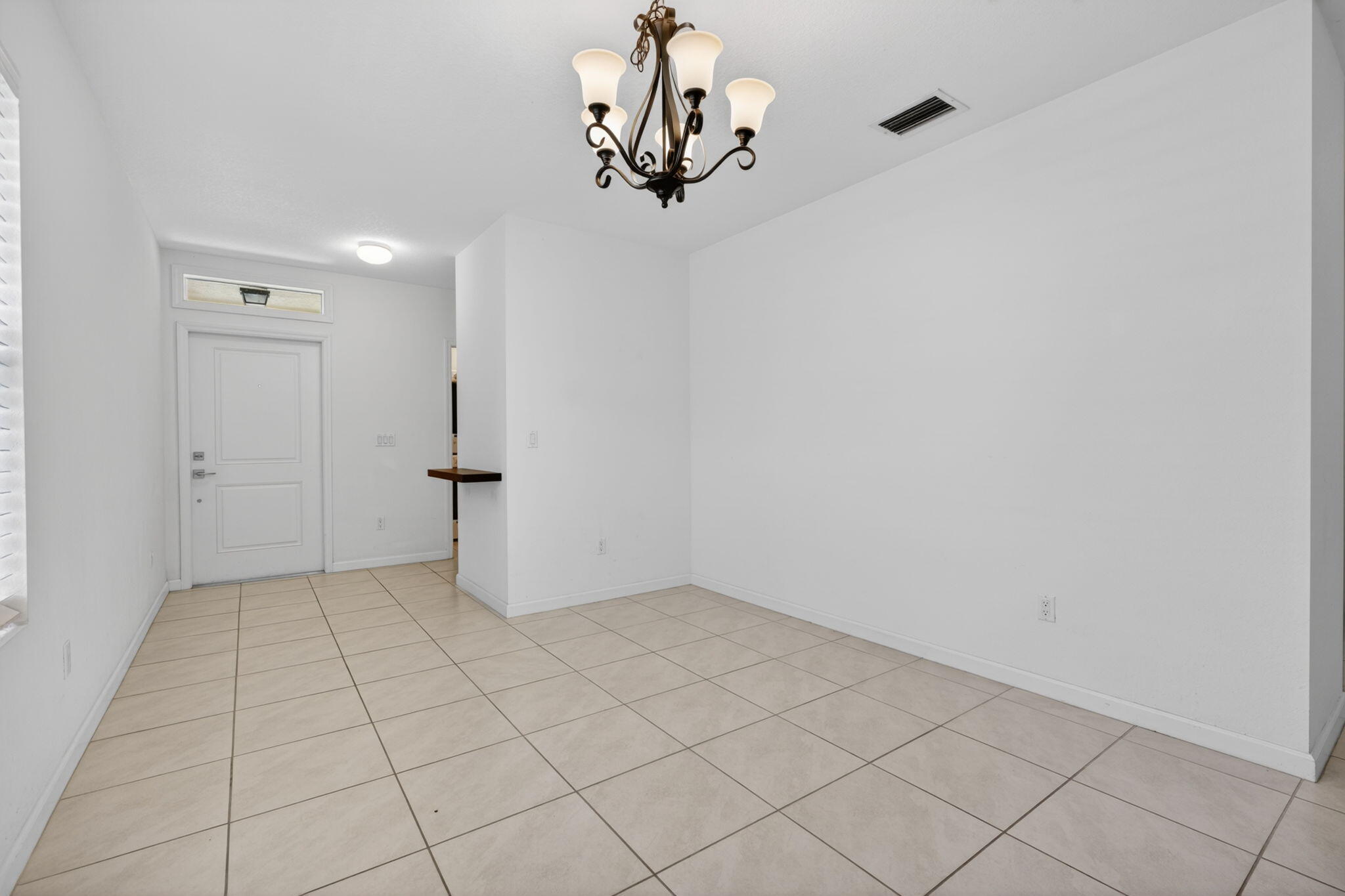 6814 Mitchell Street Jupiter, FL 33458 - Photo 4 of 49 wooden floor in an empty room
