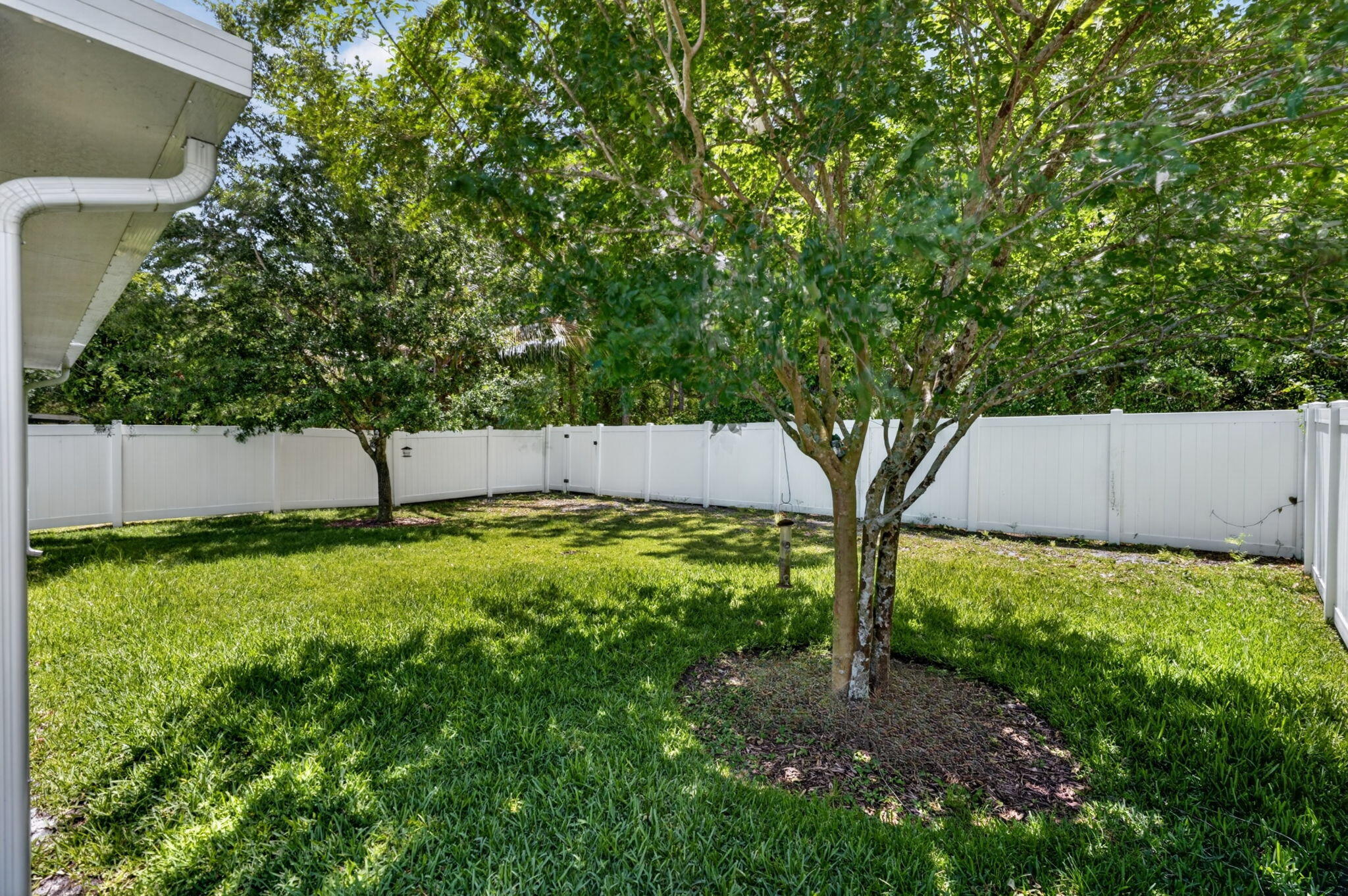 6814 Mitchell Street Jupiter, FL 33458 - Photo 41 of 49 a view of backyard with green space