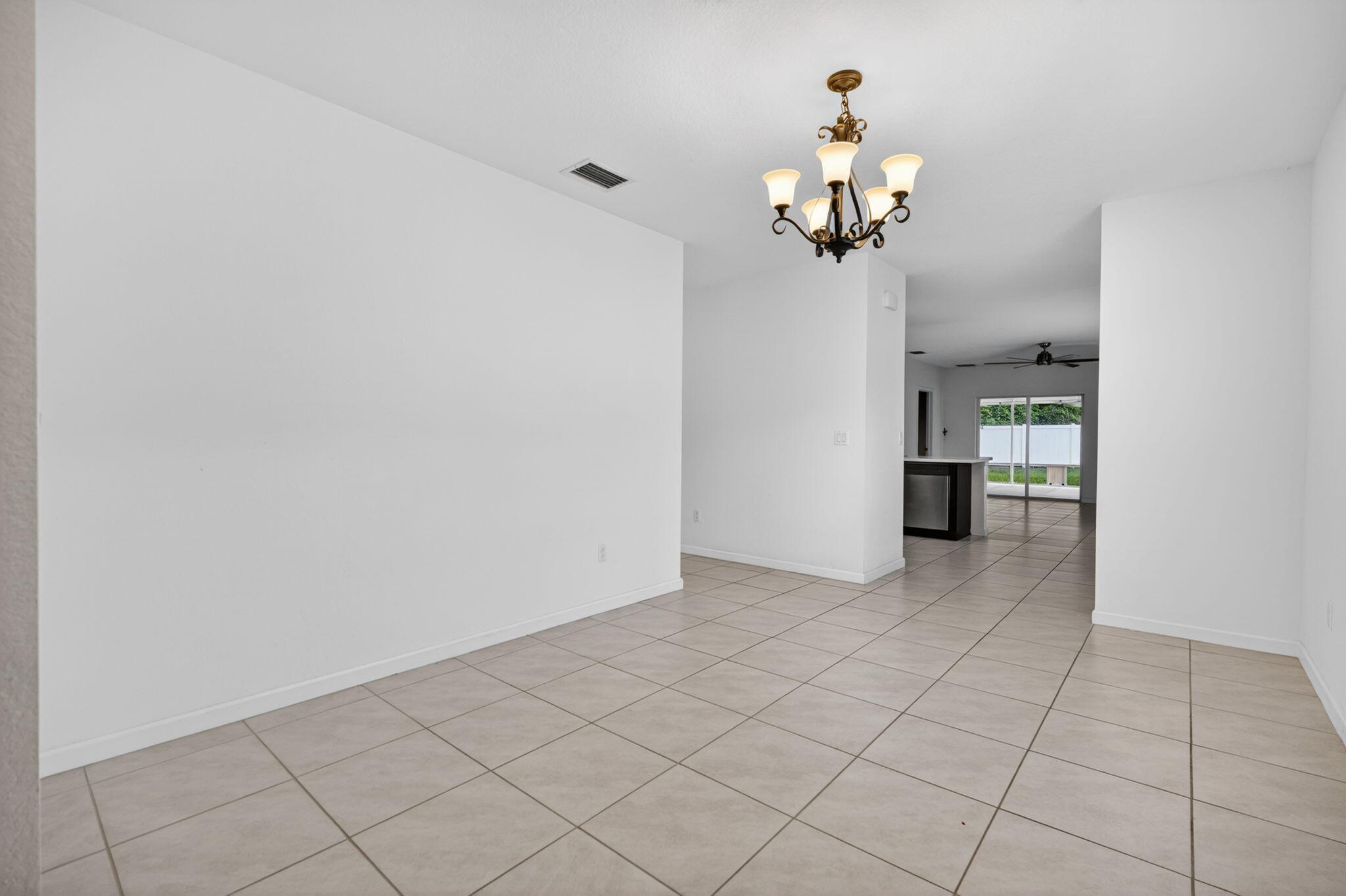 6814 Mitchell Street Jupiter, FL 33458 - Photo 7 of 49 a view of a chandelier fan