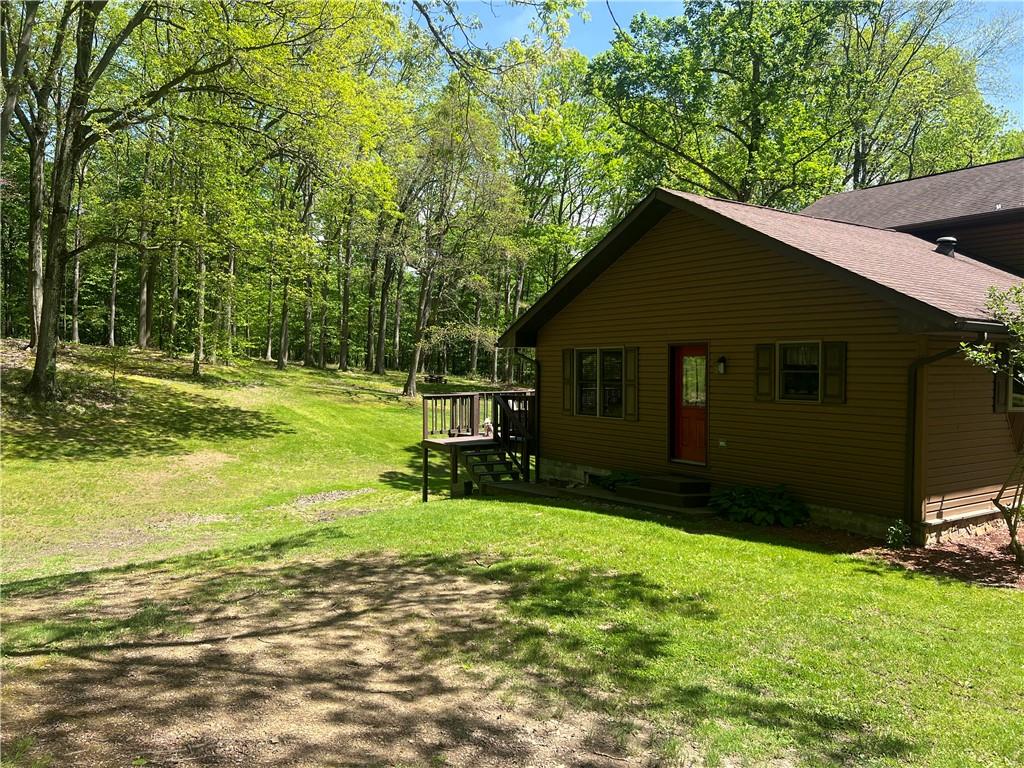 121 Pitts Road Jamestown, PA 16134 - Photo 5 of 28 a backyard of a house with table and chairs