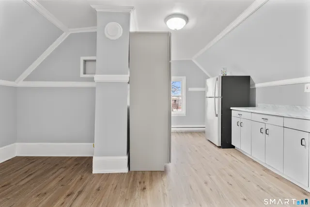 a view of a kitchen with wooden floor