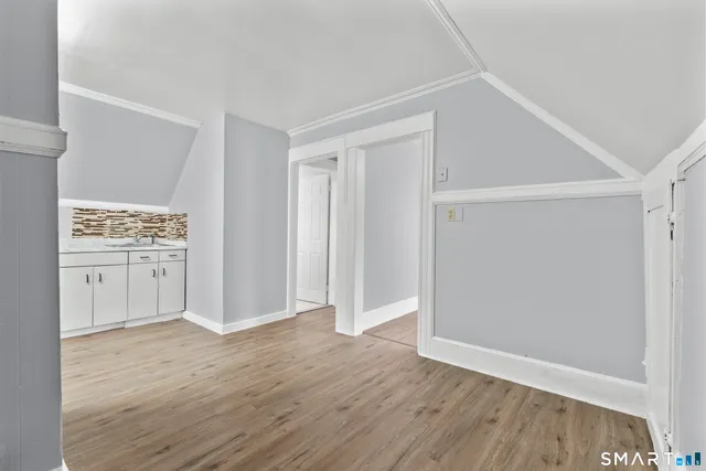 a view of cabinets with wooden floor