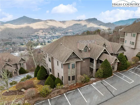 a view of a house with a mountain in the background