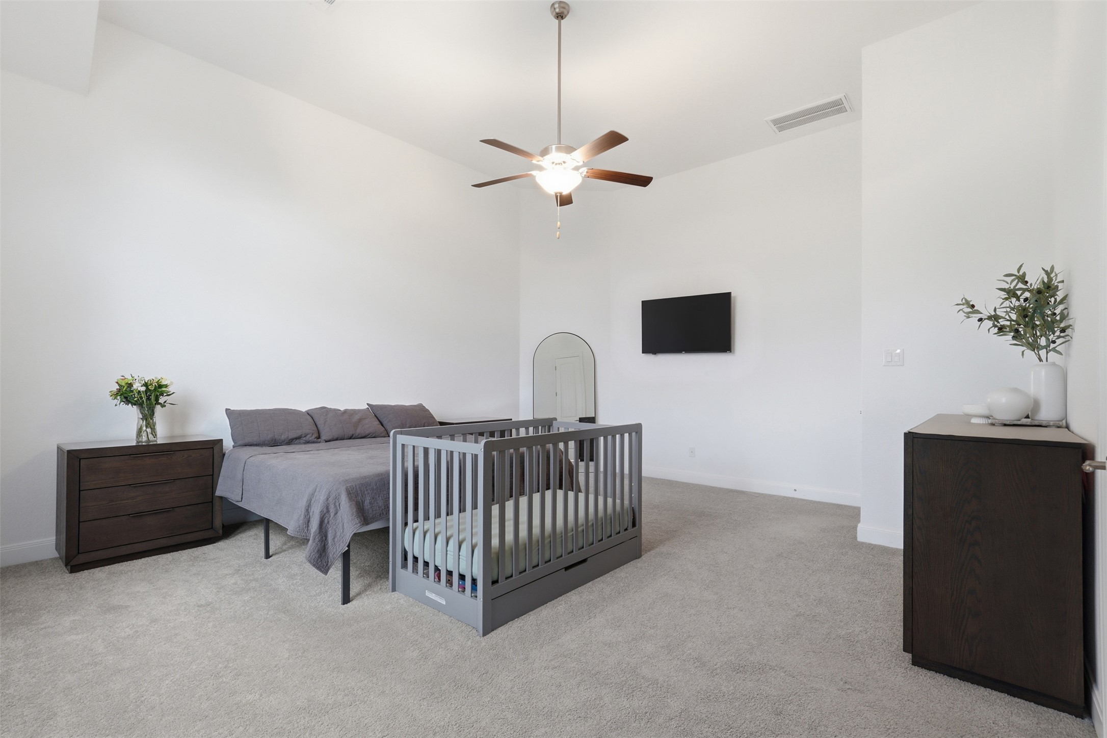 3021 Sage Ranch Drive Leander, TX 78641 - Photo 16 of 32 a bedroom with a bed and a potted plant