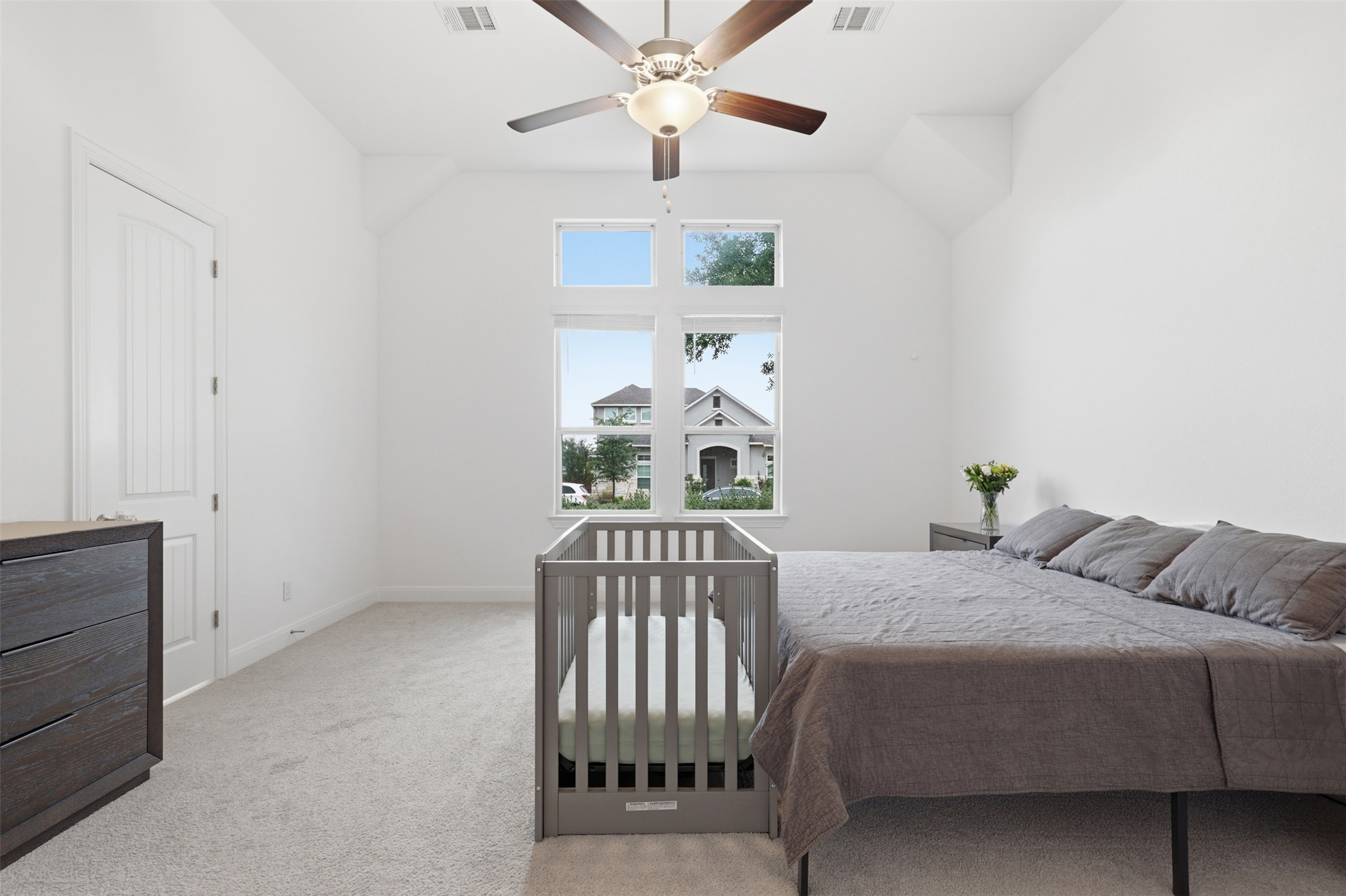3021 Sage Ranch Drive Leander, TX 78641 - Photo 17 of 32 a bedroom with a bed and a chandelier