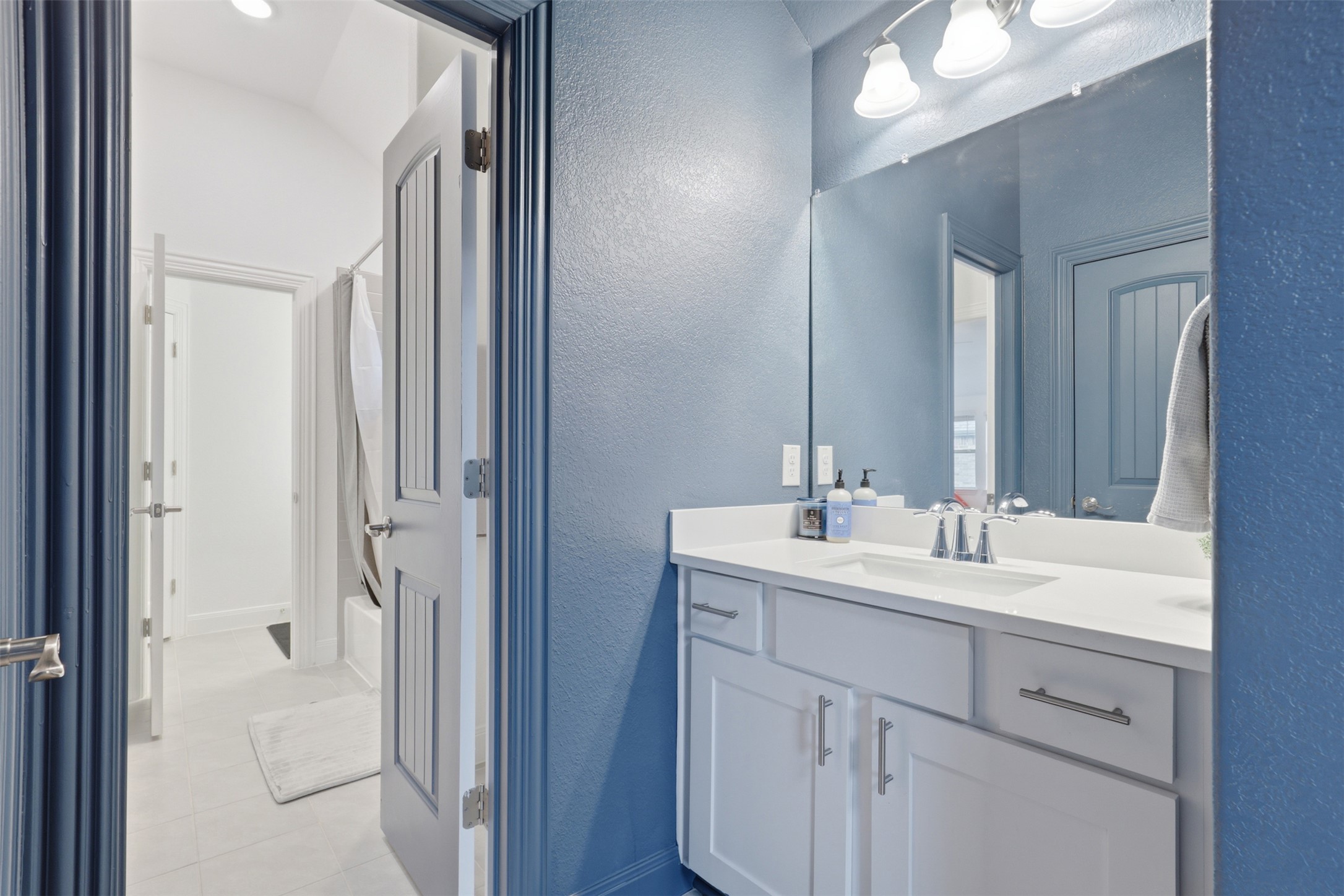 3021 Sage Ranch Drive Leander, TX 78641 - Photo 22 of 32 a bathroom with a double vanity sink mirror and
