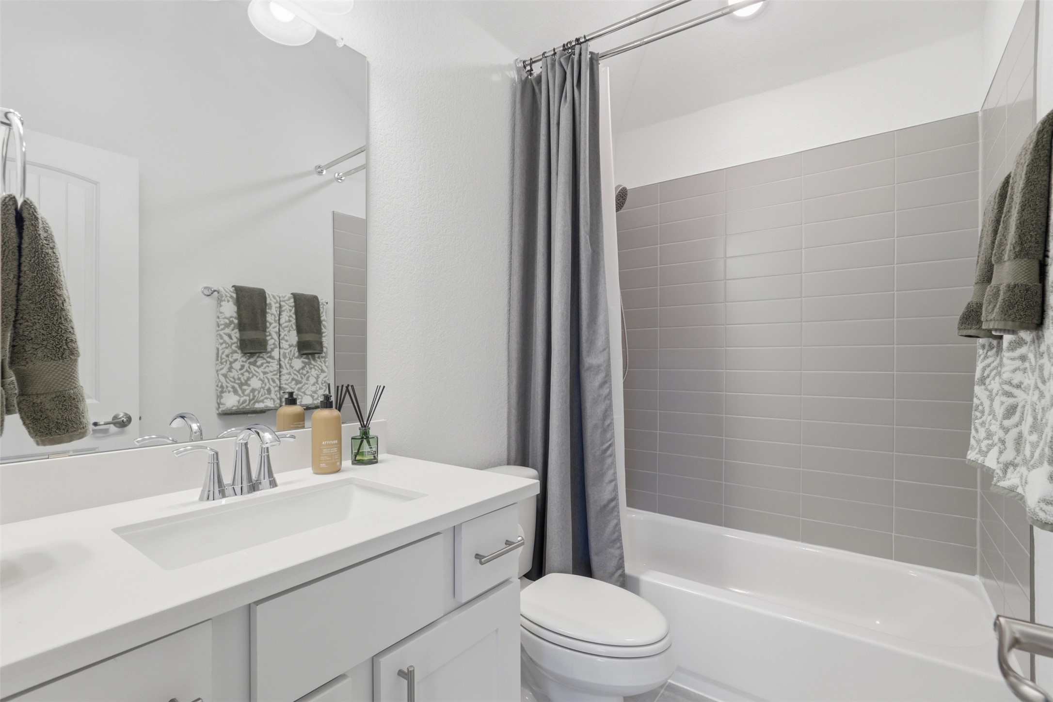 3021 Sage Ranch Drive Leander, TX 78641 - Photo 24 of 32 a bathroom with a sink a toilet a mirror and shower