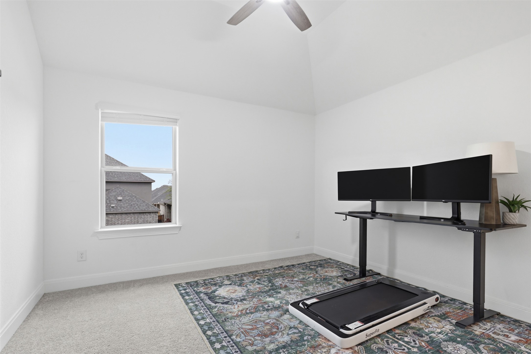 3021 Sage Ranch Drive Leander, TX 78641 - Photo 27 of 32 a living room with a flat screen tv and a lamp
