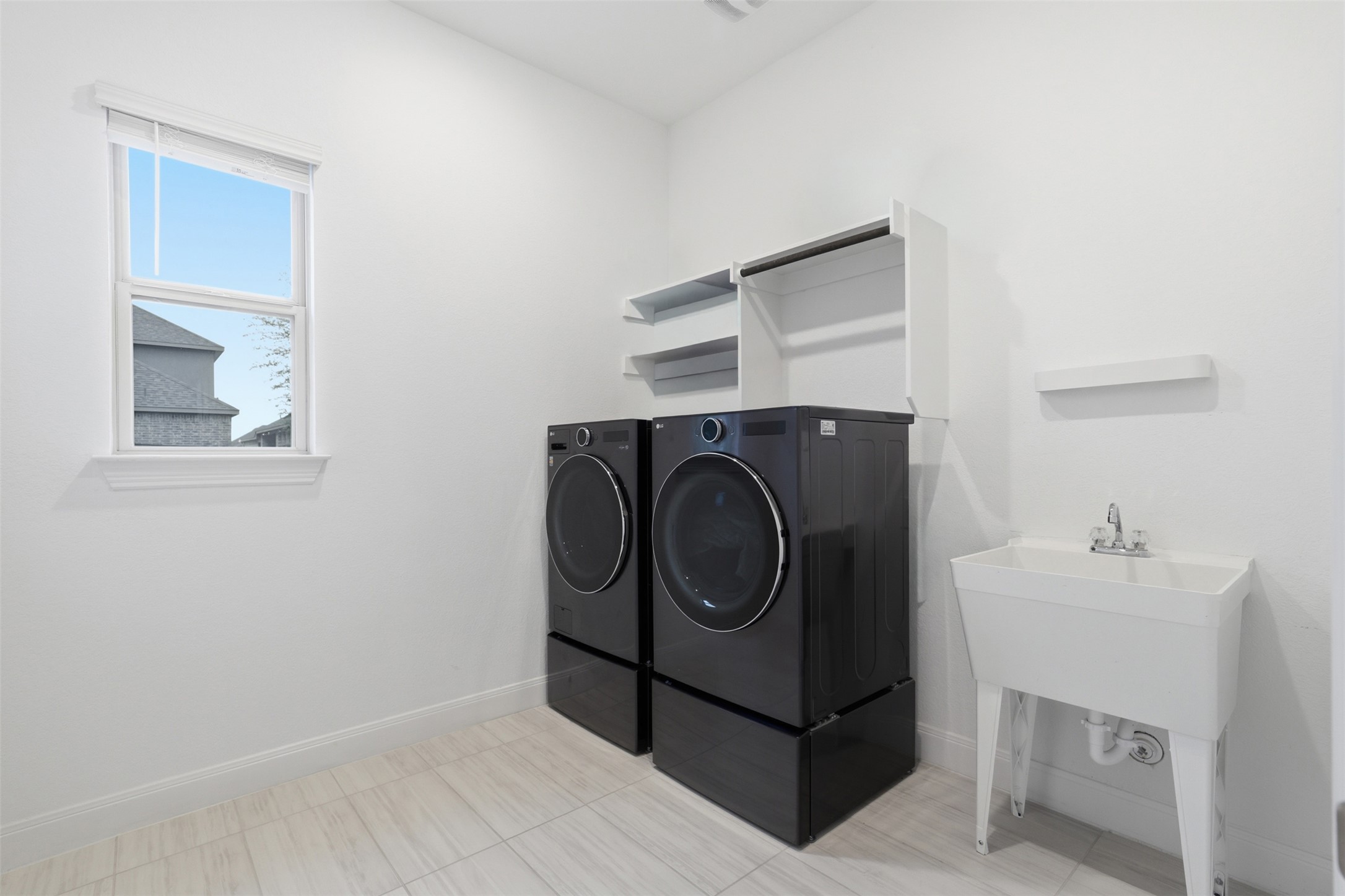 3021 Sage Ranch Drive Leander, TX 78641 - Photo 29 of 32 a utility room with dryer and washer