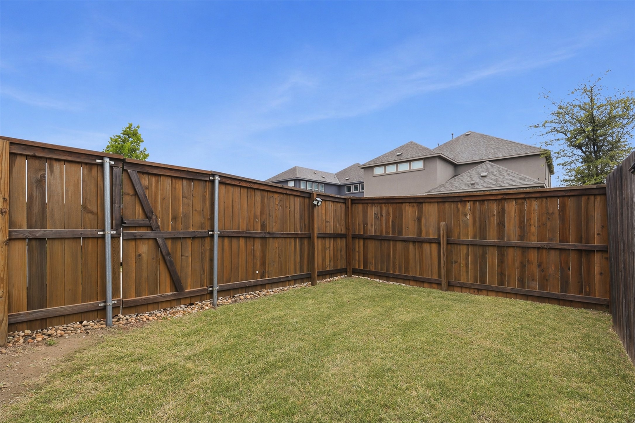 3021 Sage Ranch Drive Leander, TX 78641 - Photo 31 of 32 a view of a backyard with a fence