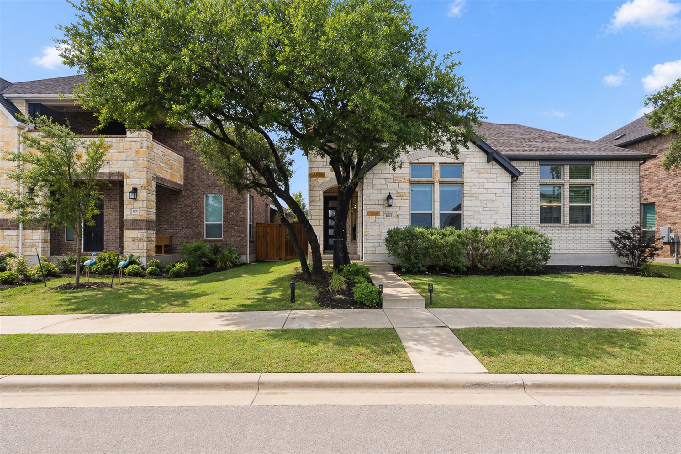 3021 Sage Ranch Drive Leander, TX 78641 - Photo 4 of 32 a front view of a house with a yard