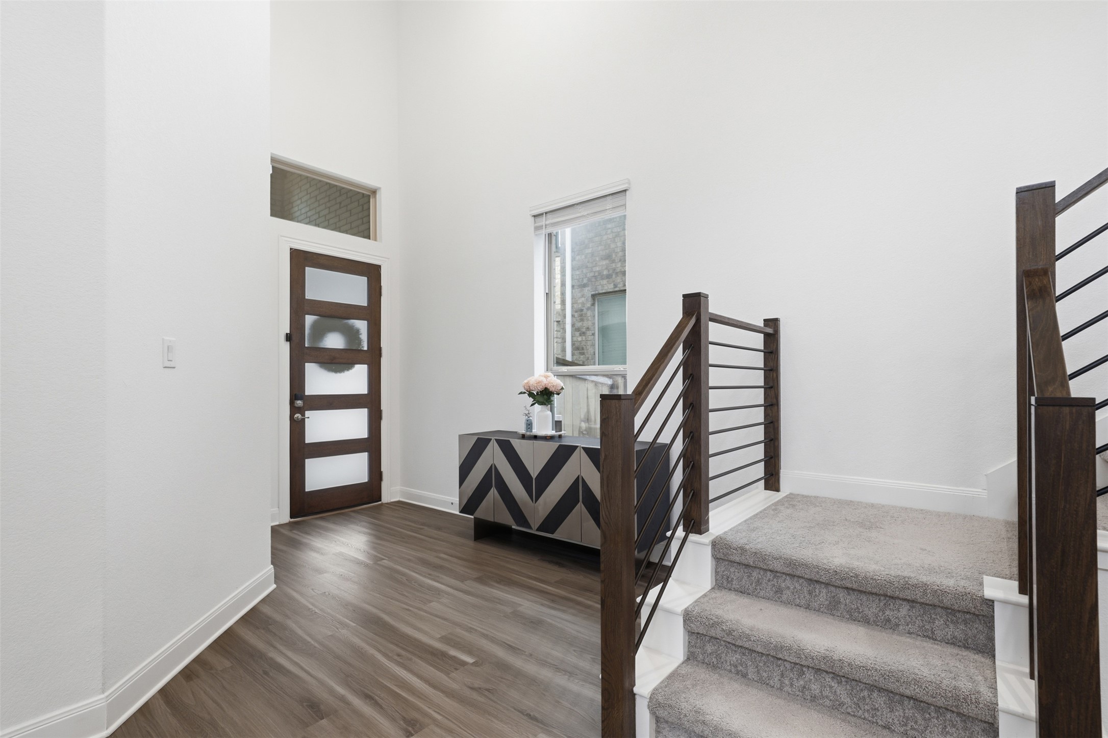 3021 Sage Ranch Drive Leander, TX 78641 - Photo 5 of 32 a view of entryway with wooden floor and stairs
