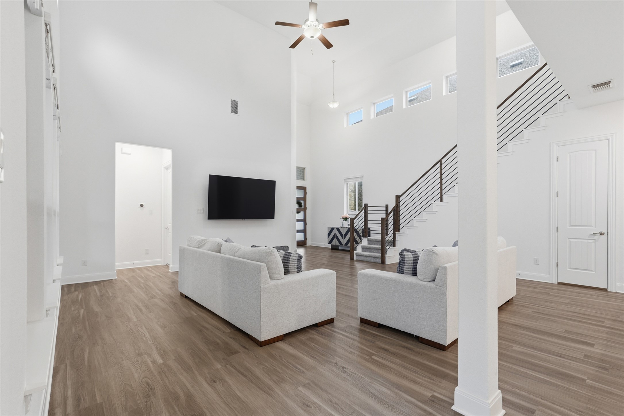 3021 Sage Ranch Drive Leander, TX 78641 - Photo 7 of 32 a living room with furniture and a flat screen tv