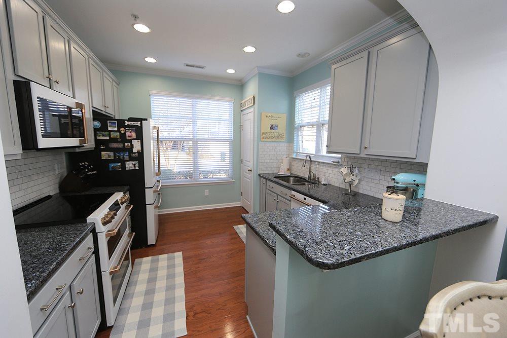 9145 Wooden Road Raleigh, NC 27617 - Photo 2 of 16 Granite Counter Tops, Painted Light Grey Cabinets.