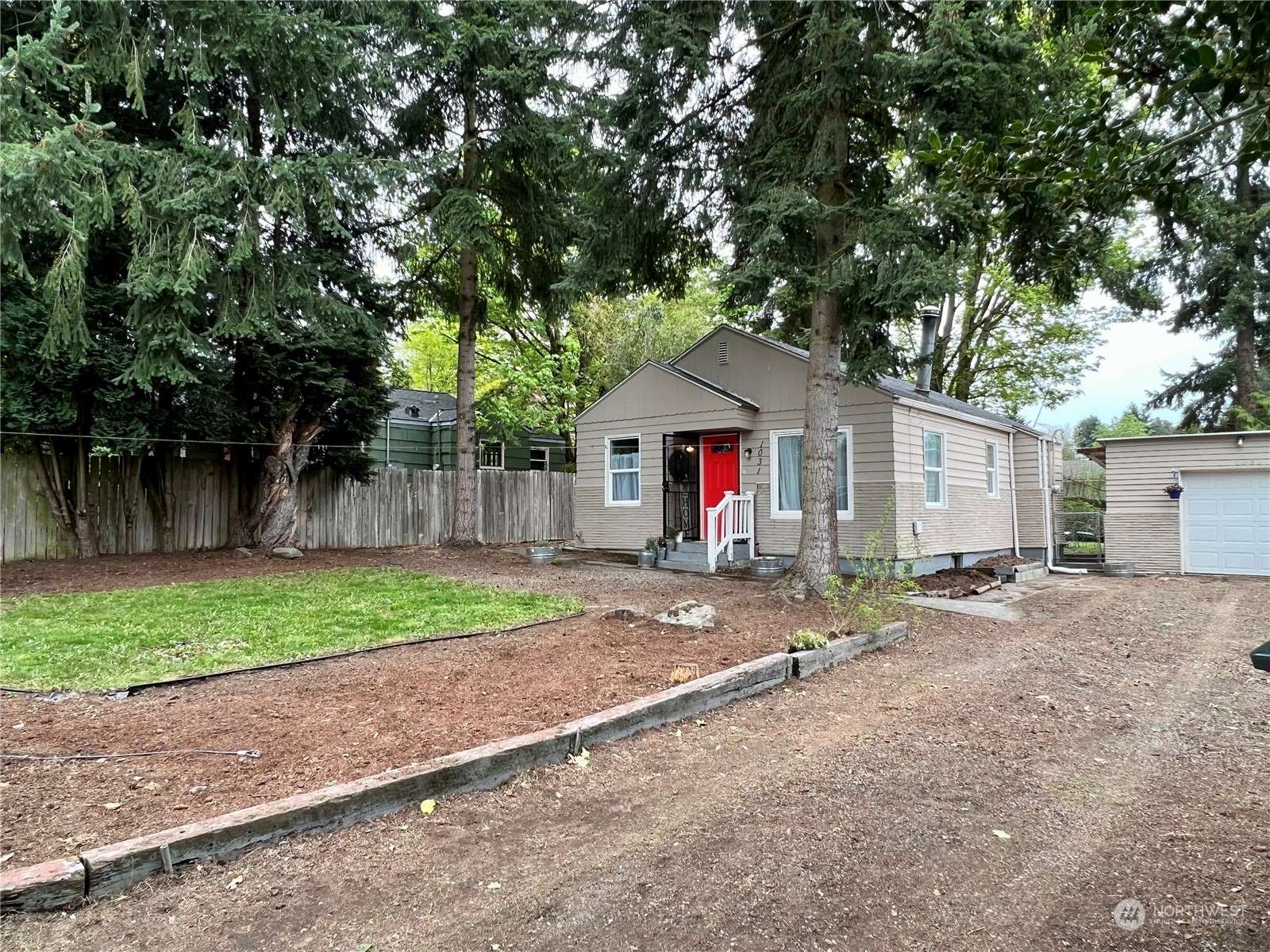 1031 Southwest 118th Street Seattle, WA 98146 - Photo 16 of 16 a backyard of a house with table and chairs