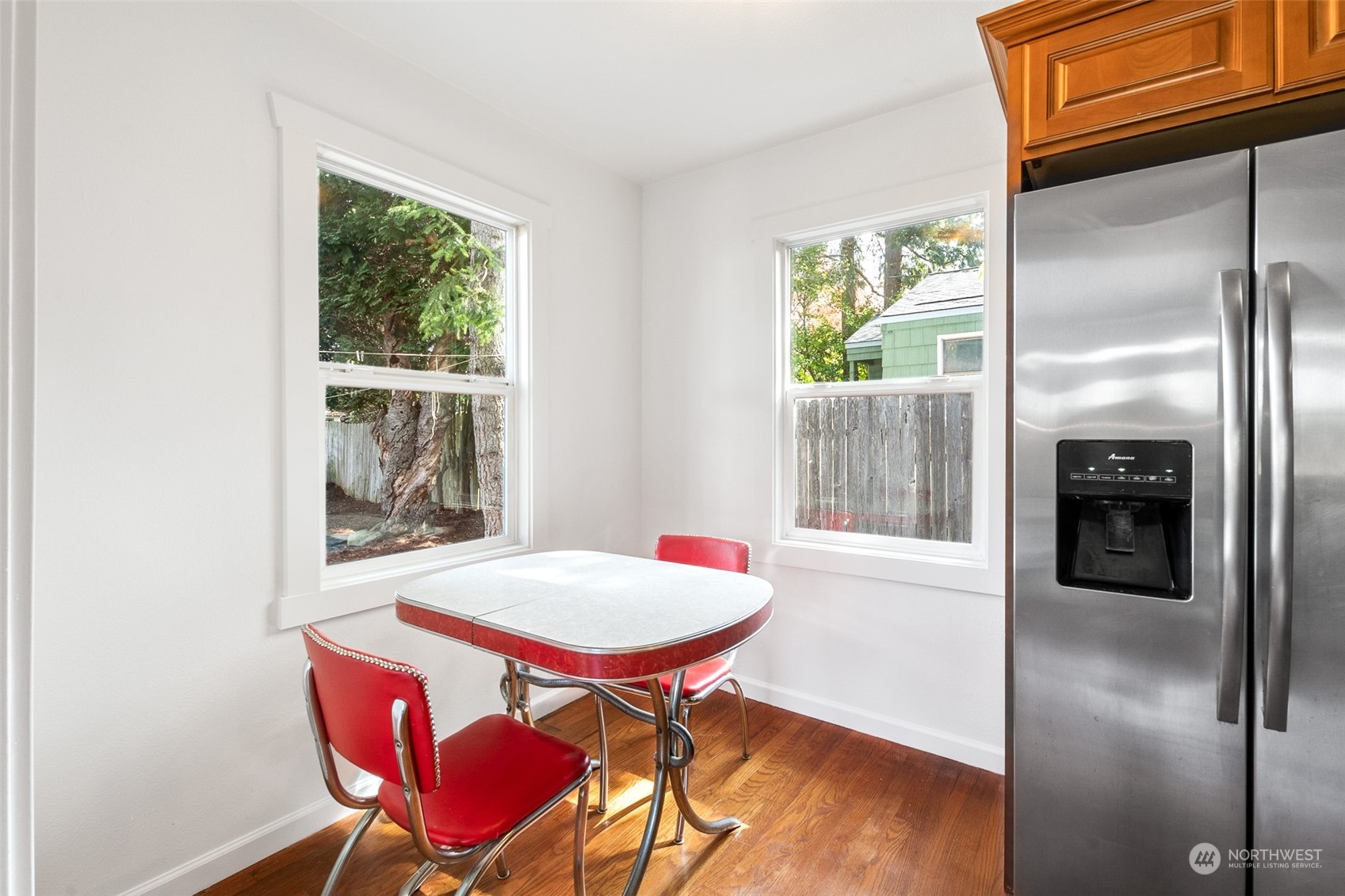 1031 Southwest 118th Street Seattle, WA 98146 - Photo 7 of 16 a view of a dining room with furniture window and wooden floor