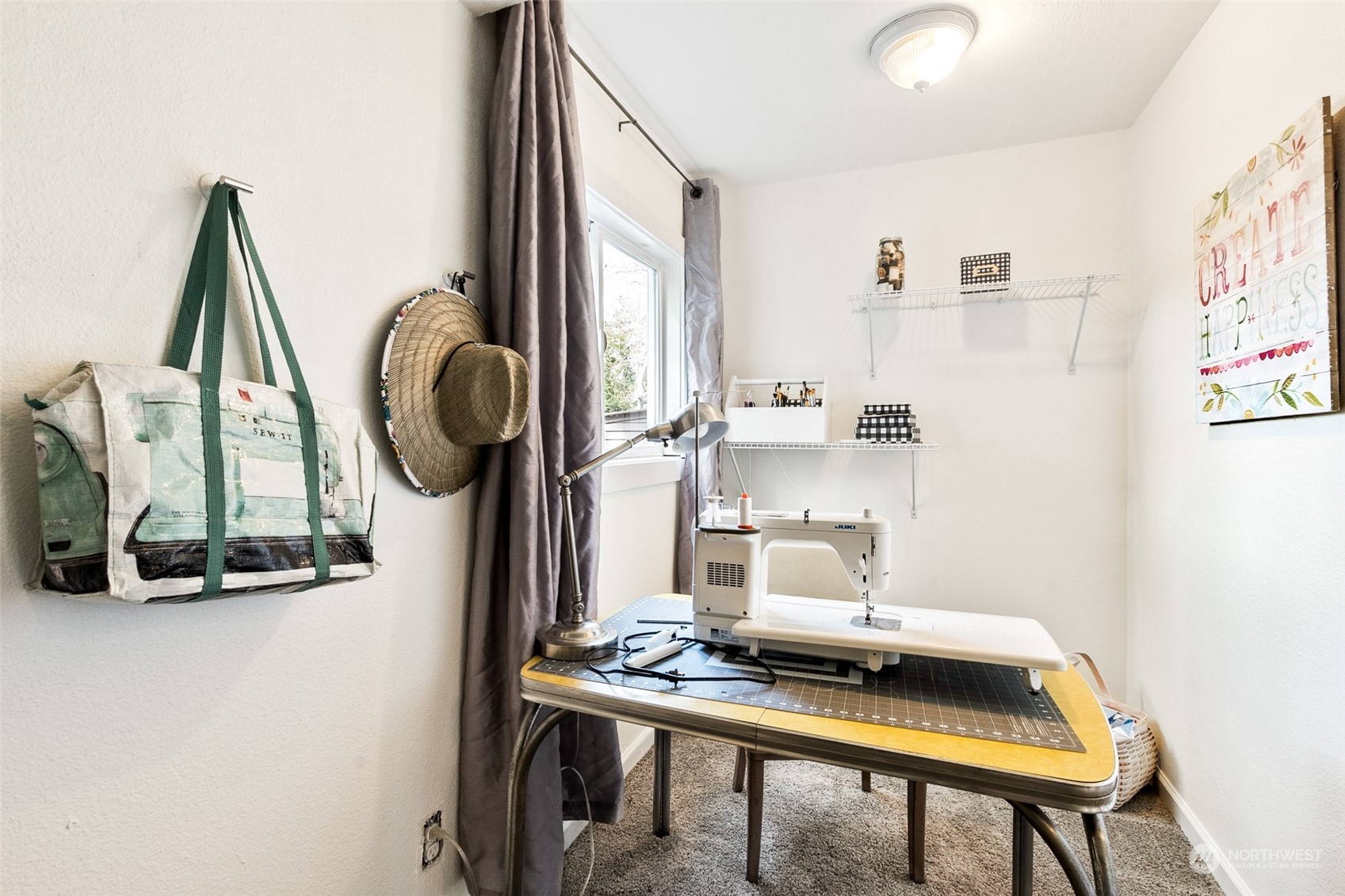 1031 Southwest 118th Street Seattle, WA 98146 - Photo 10 of 16 a view of workspace with wooden floor washer and kitchen view