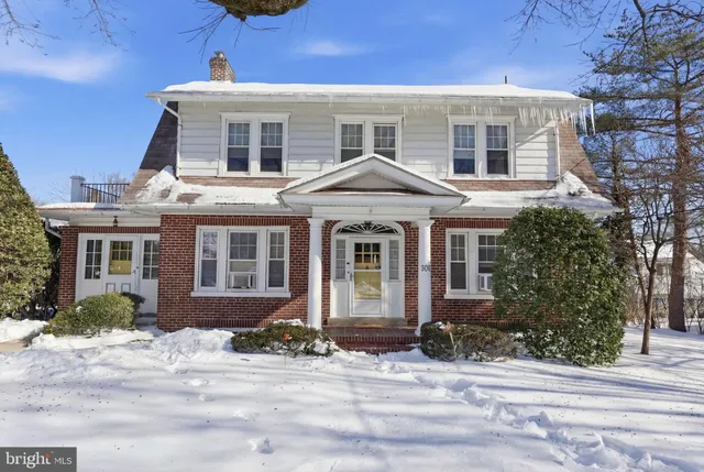 a front view of a house with yard