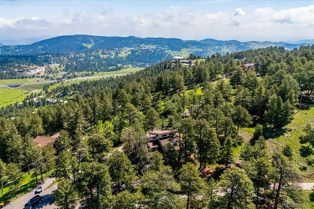 an aerial view of residential house and green space