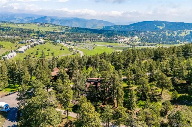 a view of a city with mountains in the background